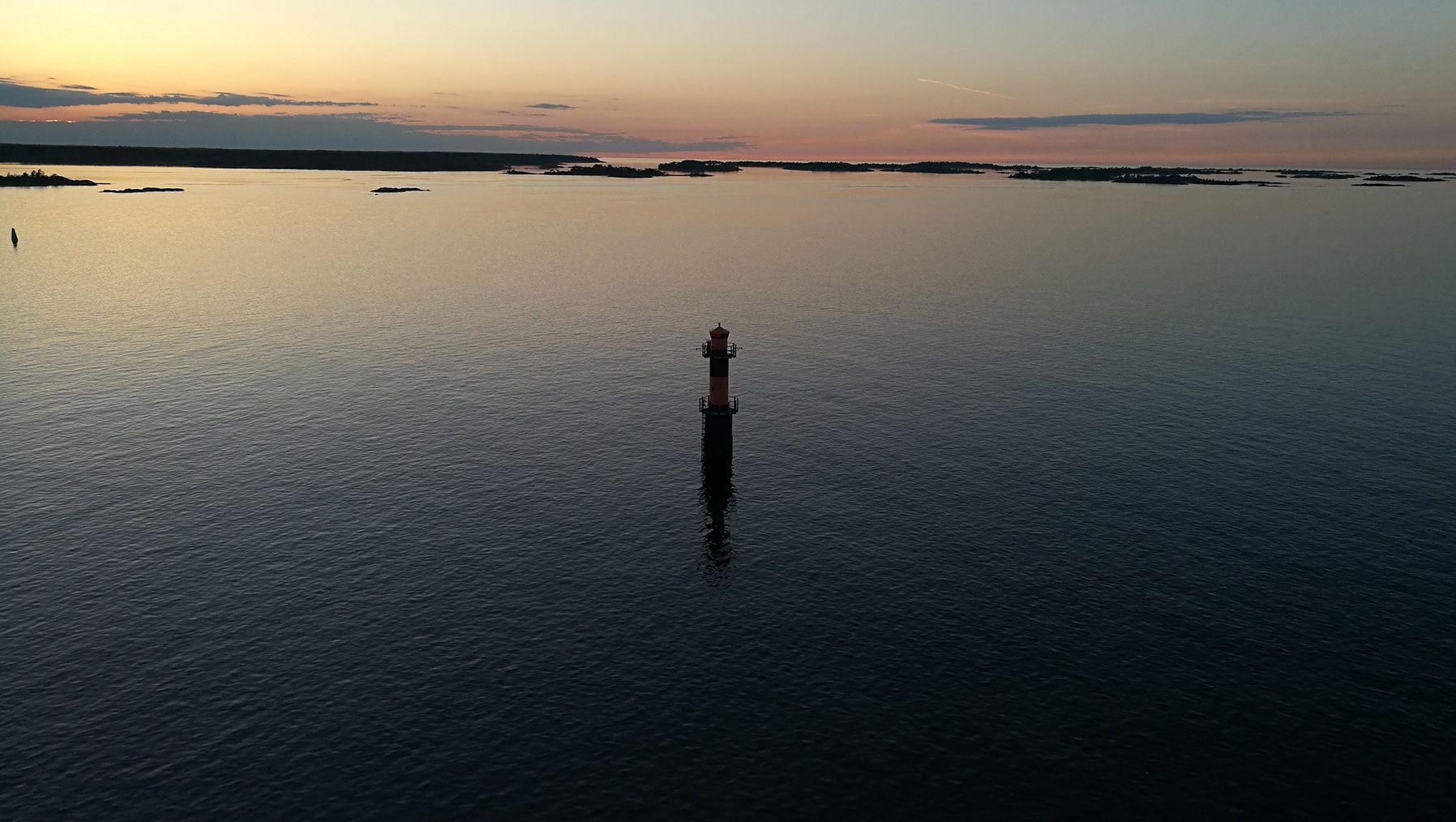 A lone lighthouse in the Baltic Sea, surrounded by Naantali's neighbouring islands.