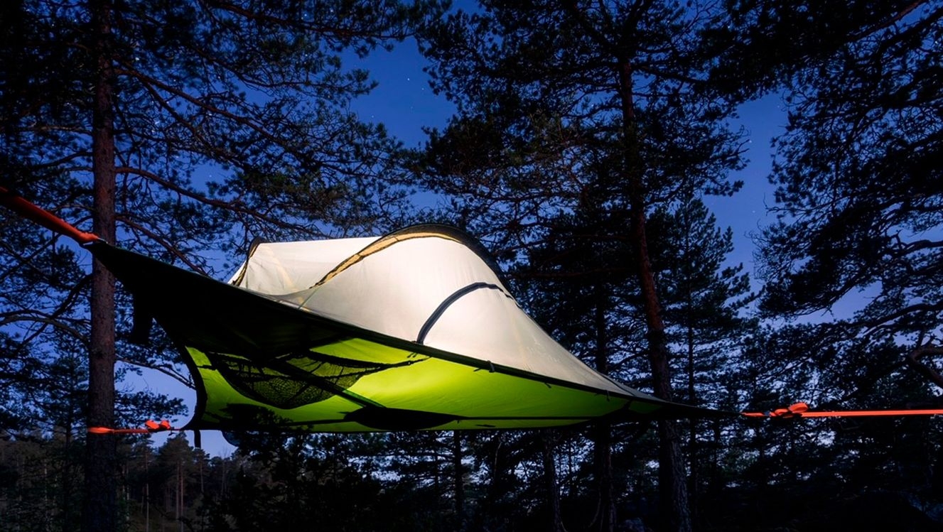 A tentsile tent strung up in a tree at Tackork Gård & Marina.