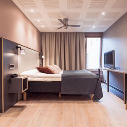 A stylish bedroom at Centro Hotel.
